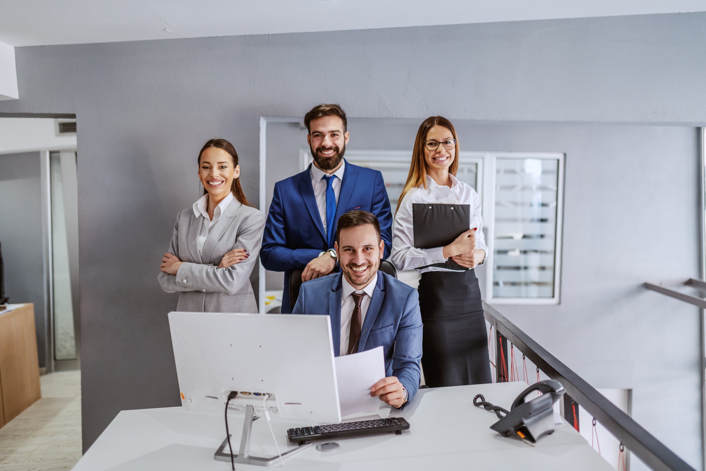 Successful team of posing in modern office. Corporate business concept.